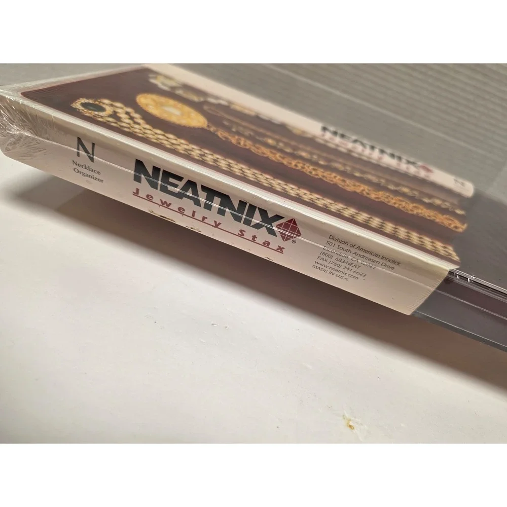 Neatnix Jewelry Stax necklace organizer tray featuring a burgundy red velvet